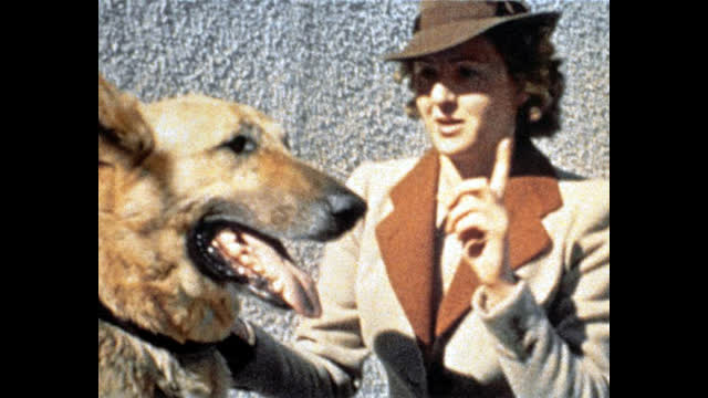 HITLER ON THE TERRACE AT HIS BERCHTESGADEN, EVA BRAUN DRESSED IN TRADITIONAL GERMAN CLOTHING, 1940S