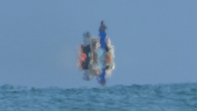 Zooming in on a boat with my Nikon P1000. Watch it fade away