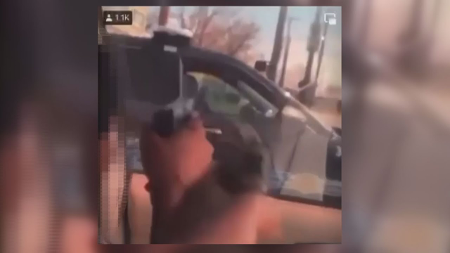 Two niggers point guns at Cleveland officer in video posted on social media