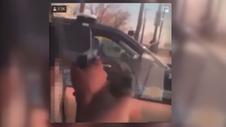 Two niggers point guns at Cleveland officer in video posted on social media