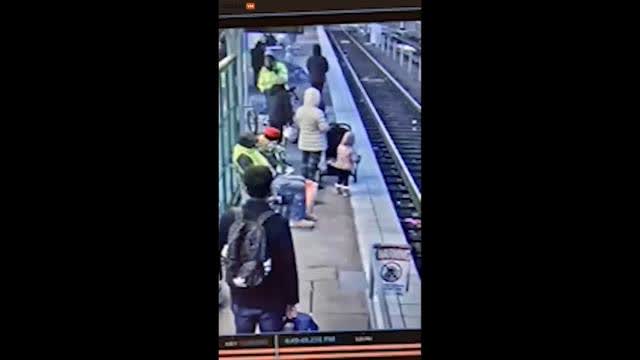 Nigger pushes young toddler onto tracks