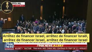 A protester shouts "The greatest threat to global security is Israel and the whole world knows it"