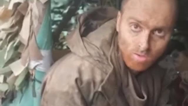 He is a mercenary captured by the Russians, he is a biology student, and he is Australian