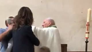 Priest slaps baby for crying during baptism
