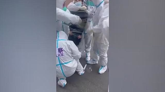 Chinese Covid Police wrapping up at the end of the day in Shanghai