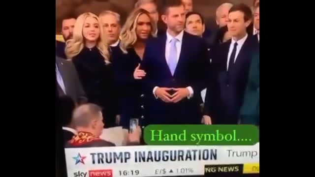 Eric Trump stands next to Jared Kushner and makes Illuminati Hand Sign