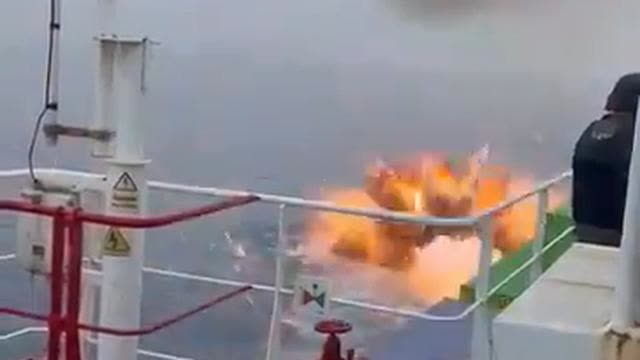 Cargo ship literally blows pirate boat out of the water.
