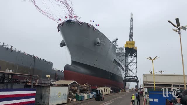 The USNS Harvey Milk rolls into the water