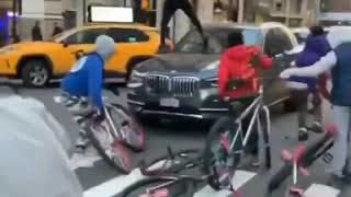 Another angle of the riotous youths swarming & attacking a driver in Manhattan